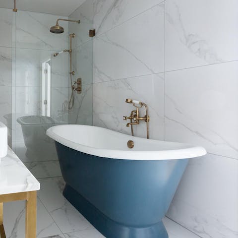 Unwind in the freestanding bathtub after a busy day exploring London
