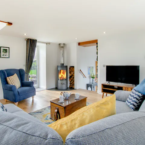 Spend cosy evenings getting snug on the plush sofas while the fireplace warms you up