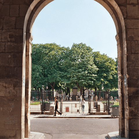 Enjoy a moment in nearby Place des Vosges, Paris' oldest square