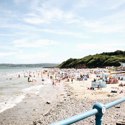 Take a fifteen-minute drive to spend the afternoon at Traeth Mawr beach