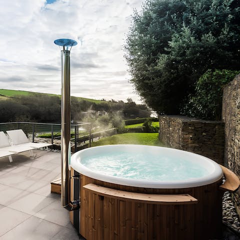 Slip into the wood-fired hot tub and enjoy the views
