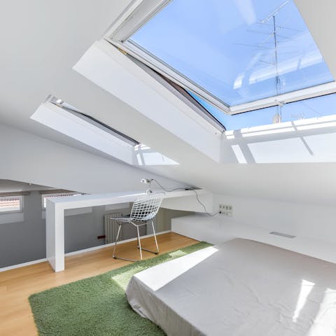 Catch up on work in the light-filled mezzanine bedroom