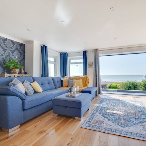 Stretch out on the corner sofa as the sea breeze rolls in through the sliding doors