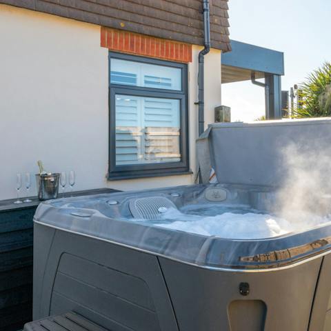 Treat yourself to a relaxing soak in the hot tub