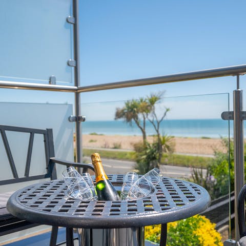 Raise a glass to your well-deserved break, looking out over the pebble beach and the English Channel beyond
