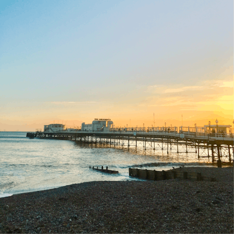 Stroll along Worthing's iconic Victorian pier, approximately a mile away