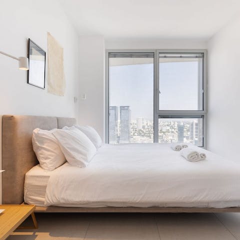 Gaze out at the streets of central Tel Aviv from your cosy master bedroom