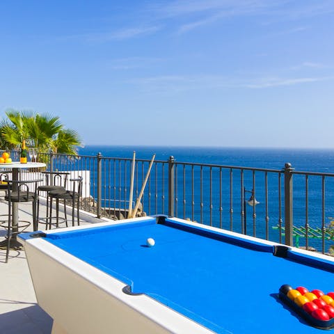 Play billiards on the terrace with panoramic sea views