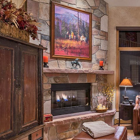 Get cosy by the stone fireplace