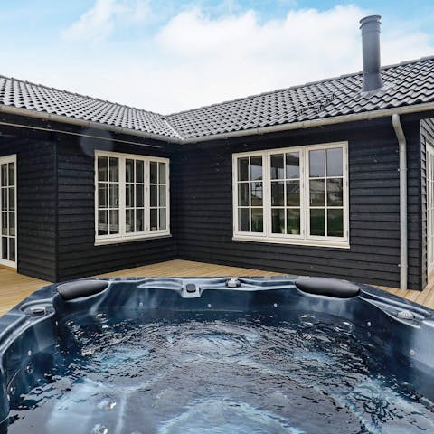 Sink into the hot tub for a long, luxurious soak under the stars