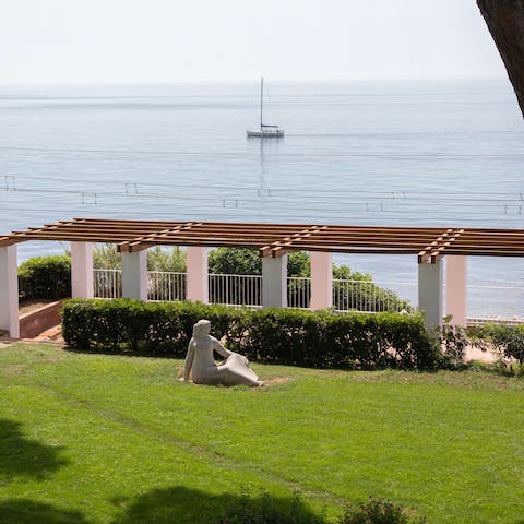 Find a comfy spot in the villa's garden and gaze out over the view of the Med