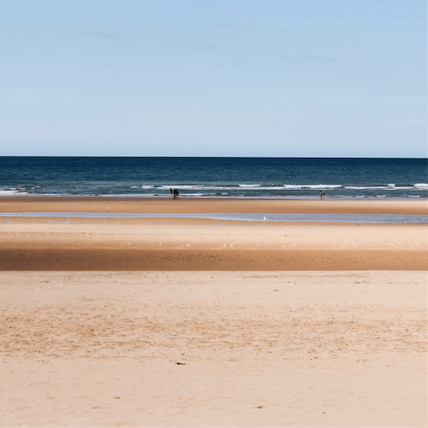 Take the short twelve-minute stroll to Deauville beach and feel the sand between your toes