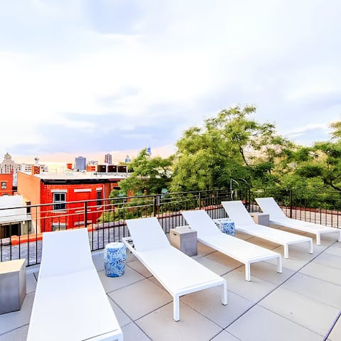 Stretch out on the rooftop loungers with a cocktail