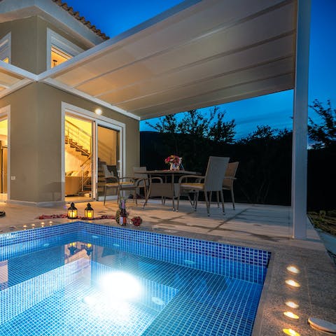 Plunge in your private pool on a balmy evening before making cocktails
