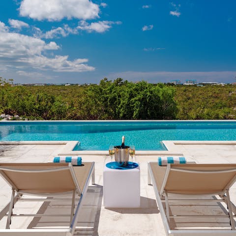 Savour a glass or two of fizz while lazing on loungers in the sun and admiring the view