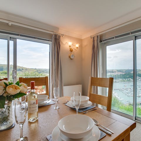 Enjoy a banquet on the dining table next to the floor-to-ceiling windows