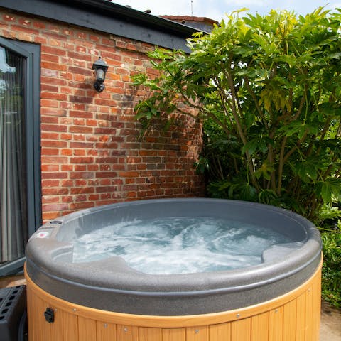 Relax and unwind with a starlit dip in the hot tub