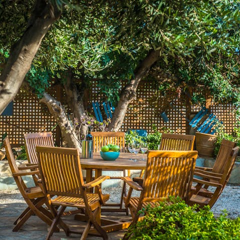 Gather around the alfresco dining table for an array of Greek dishes