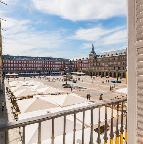 Perch by the bedroom's  Juliet balconies with a glass of Spanish wine while watching the goings-on in Plaza Mayor