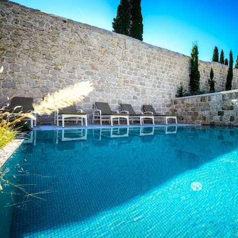 Jump into the home's swimming pool and cool off during the height of summer