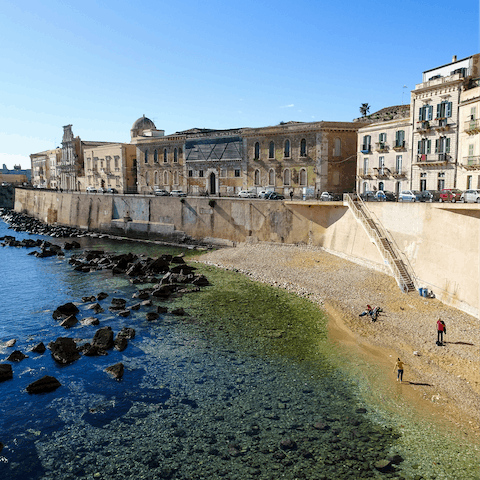 Visit the charming Ortigia, just within twenty–five–minute drive away