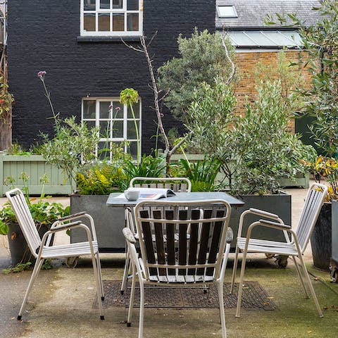 Enjoy sundowners and a barbecue  in the quiet courtyard garden