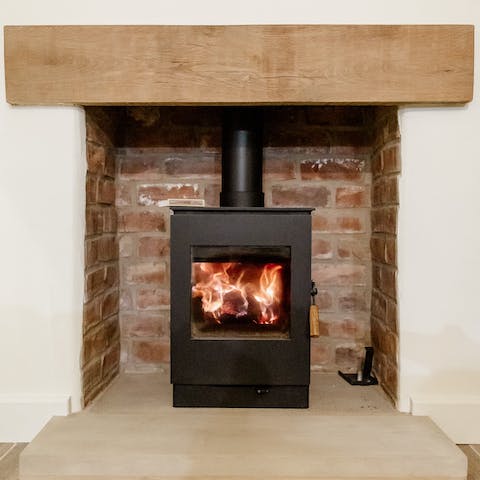 Cosy up in front of the log burner fire on cold winter's evenings 