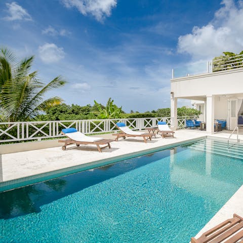 Feel the refreshing spirit of tropical living whilst lounging by the pool