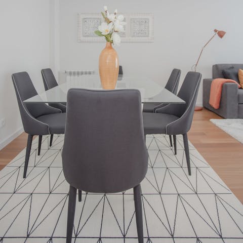 Enjoy a leisurely homecooked meal together in this sleek and sociable dining area