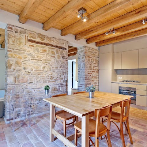 Enjoy charming farmhouse touches like exposed stone walls and wooden ceilings