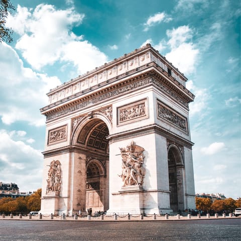 Climb the Arc de Triomphe and witness stunning views of the Eiffel Tower