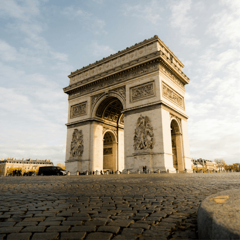 Begin your sightseeing at the Arc de Triomphe, a twenty-minute walk away