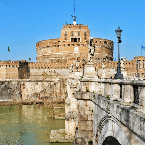 Gaze up at Castel Sant'Angelo – Hadrian's tomb towers over the Tiber just a few minutes away