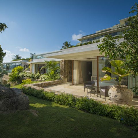 Make the most of indoor-outdoor living – open the French doors in the bedroom out onto a private terrace and garden views