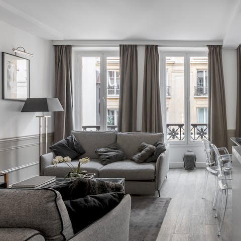 Relax in the living room where French windows fill the place with light