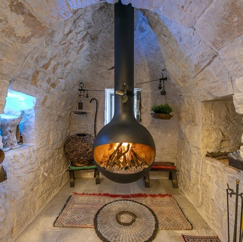 Cosy up by the wood-burning stove on cooler evenings