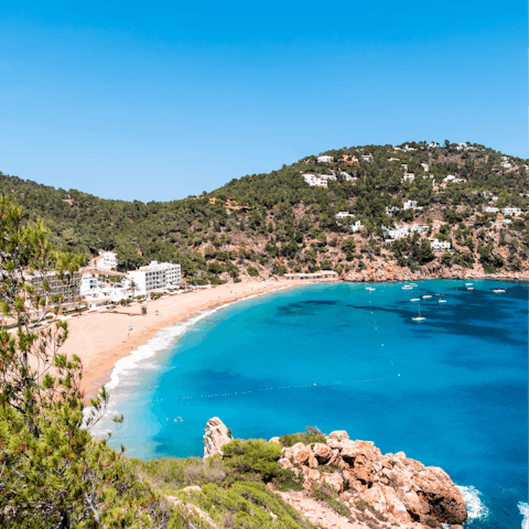 Sink your toes into the sands of Cala Pinet, just 1.9km away