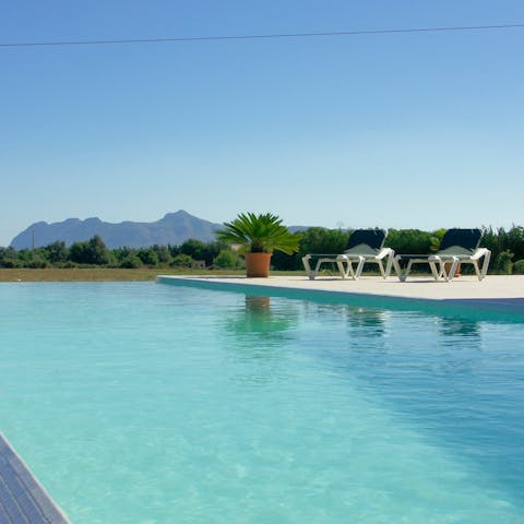 Admire the mountain views whilst relaxing by the pool