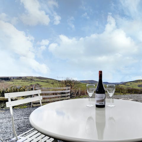 Savour a glass of red wine on the patio as you look out to the rolling landscapes