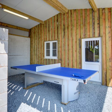Compete in a friendly game of table tennis 