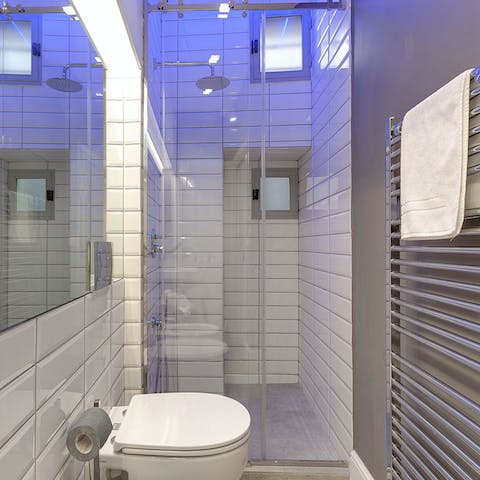 Start mornings with a luxurious soak under the rainfall showers in the light-changing bathrooms
