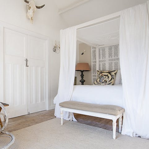 Sleep in the luxurious four poster bed