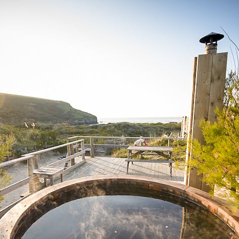 Take in the incredible coastal views from the hot tub on the deck