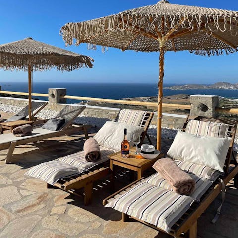 Grab a book and a beach towel and lie back with a drink on the plush loungers