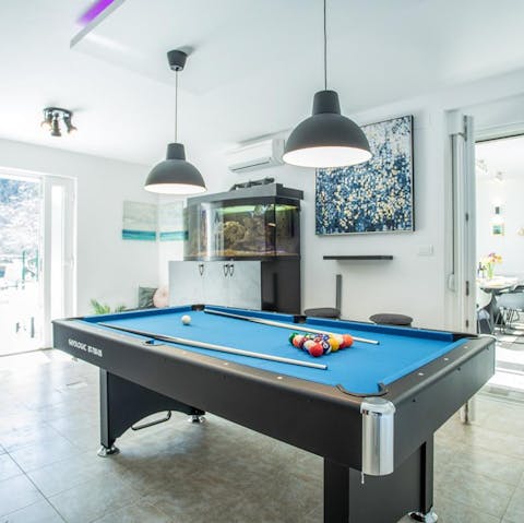 Show off your potting skills on the home's pool table