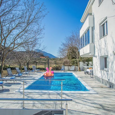 Splash about in the private swimming pool and admire the rural scenery