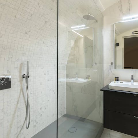 Feel anew in the marble-clad rainfall shower