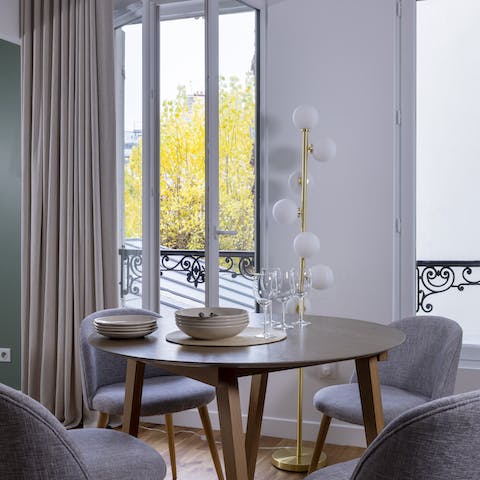 Serve up delicious French fare on the apartment's long dining table