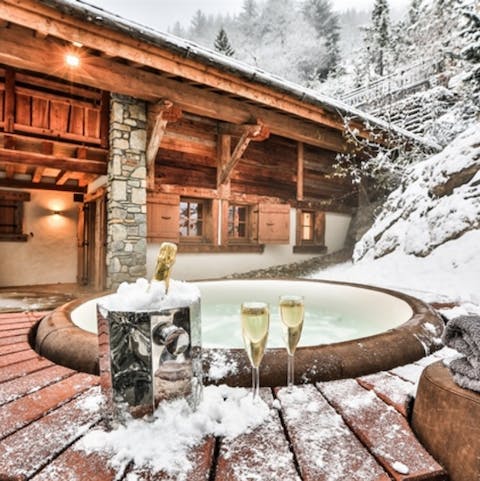 Brave the chilly temperatures and bathe in the warmth of the hot tub