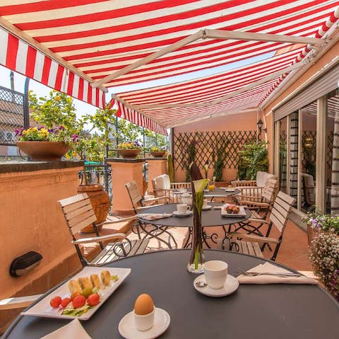 Take breakfast in the shade of an awning on the private terrace